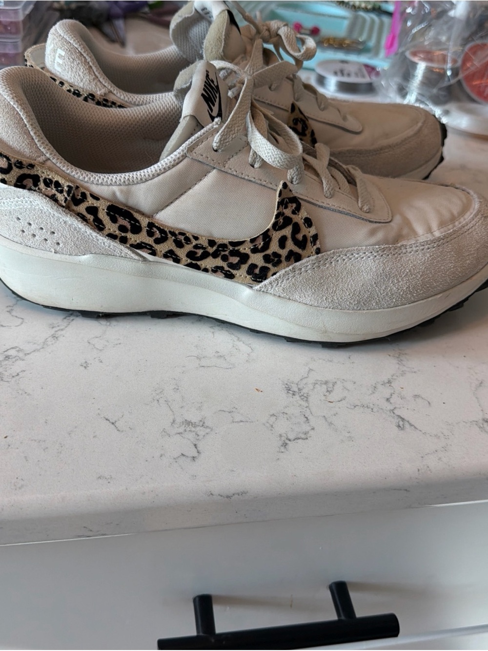 Nike Women’s Cream Sneakers with Leopard Swoosh Accent